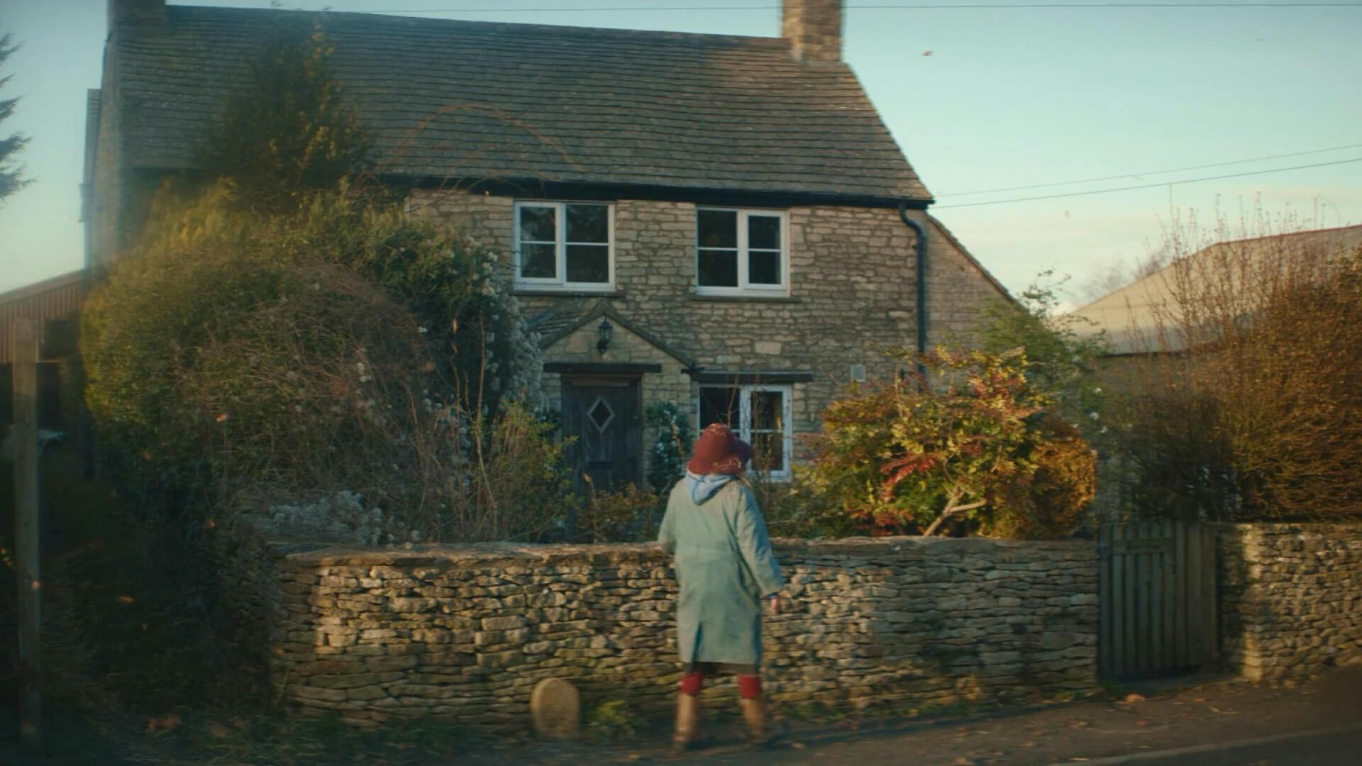 Woman outside house - One Day Could Be Today Rightmove campaign
